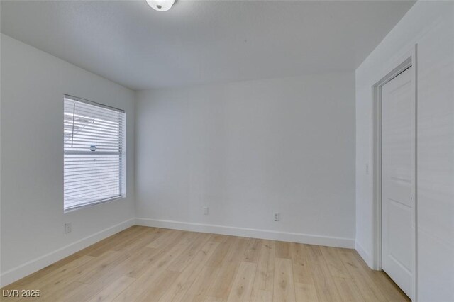 6800 E Lake Mead Blvd Unit 1034, Las Vegas, NV 89156 - empty room featuring light wood finished floors and baseboards