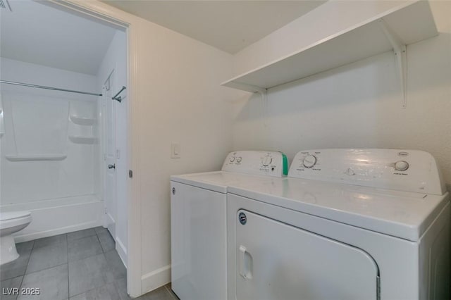 6800 E Lake Mead Blvd Unit 1034, Las Vegas, NV 89156 - laundry room featuring separate washer and dryer, light tile patterned floors, and baseboards