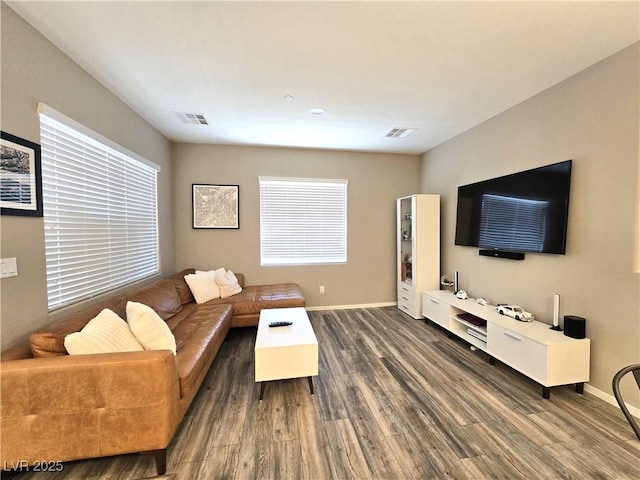 8534 Insignia Ave Unit 101, Las Vegas, NV 89178 - living area with dark wood-type flooring and baseboards