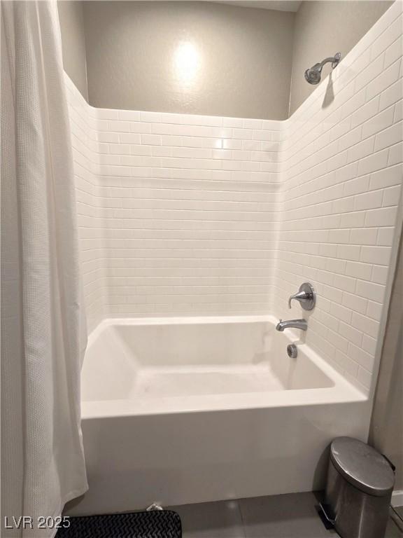 8534 Insignia Ave Unit 101, Las Vegas, NV 89178 - bathroom with shower / bath combination with curtain, tile patterned flooring, and toilet