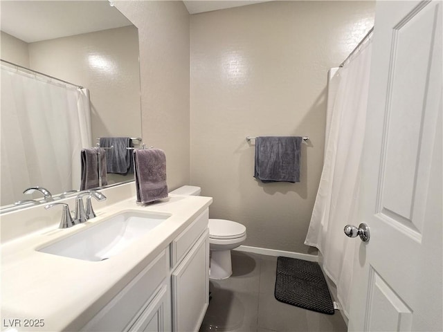 8534 Insignia Ave Unit 101, Las Vegas, NV 89178 - bathroom featuring toilet, vanity, tile patterned floors, baseboards, and a shower with shower curtain
