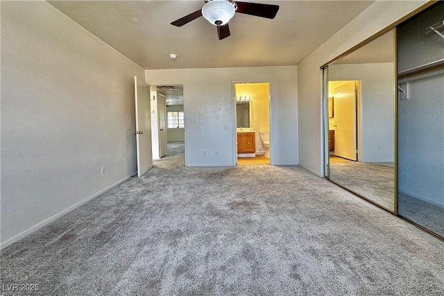 8410 Eldora Ave Unit 2046, Las Vegas, NV 89117 - unfurnished bedroom with carpet floors, a closet, baseboards, ensuite bath, and a ceiling fan