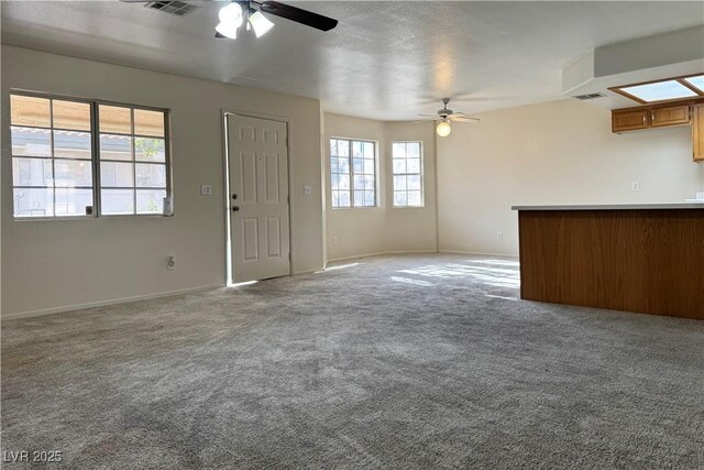 8410 Eldora Ave Unit 2046, Las Vegas, NV 89117 - unfurnished living room featuring ceiling fan and carpet flooring
