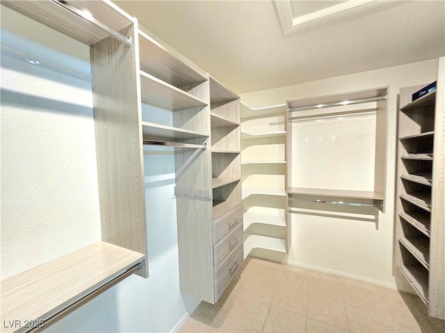 2035 E Warm Springs Rd Unit 1017, Las Vegas, NV 89119 - spacious closet featuring light tile patterned floors
