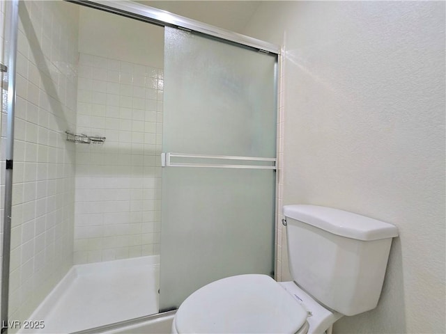 2035 E Warm Springs Rd Unit 1017, Las Vegas, NV 89119 - bathroom featuring toilet and a shower stall