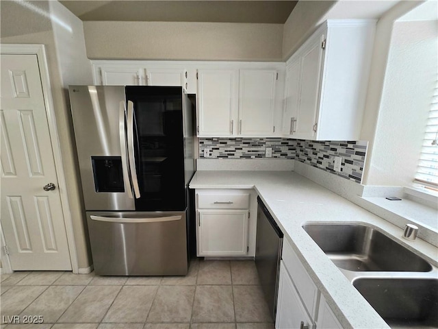 2035 E Warm Springs Rd Unit 1017, Las Vegas, NV 89119 - kitchen featuring stainless steel appliances, light tile patterned floors, and white cabinets