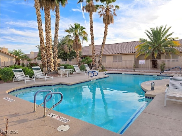 2035 E Warm Springs Rd Unit 1017, Las Vegas, NV 89119 - community pool with a patio