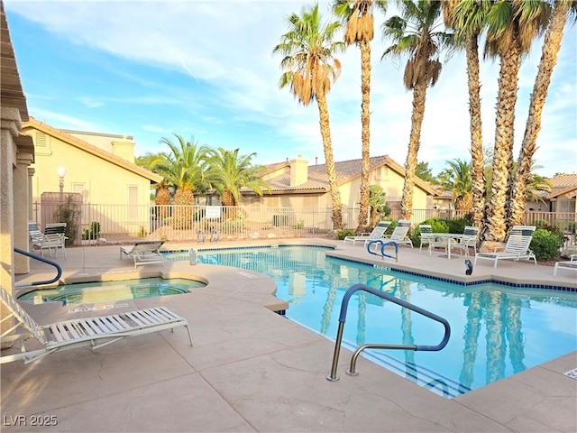 2035 E Warm Springs Rd Unit 1017, Las Vegas, NV 89119 - community pool with a hot tub and a patio area