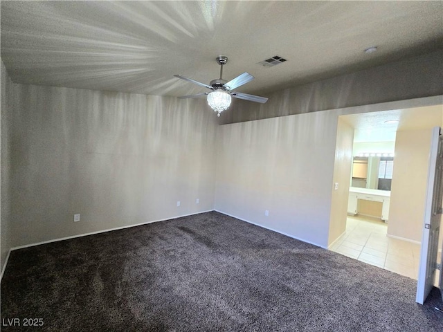 2035 E Warm Springs Rd Unit 1017, Las Vegas, NV 89119 - carpeted spare room featuring a ceiling fan and tile patterned flooring