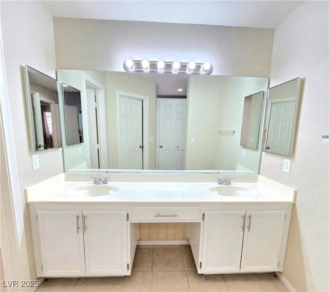 2035 E Warm Springs Rd Unit 1017, Las Vegas, NV 89119 - full bath with double vanity, tile patterned flooring, and baseboards