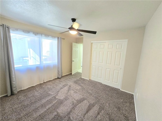 2035 E Warm Springs Rd Unit 1017, Las Vegas, NV 89119 - unfurnished bedroom featuring carpet flooring, ceiling fan, a closet, and a textured ceiling