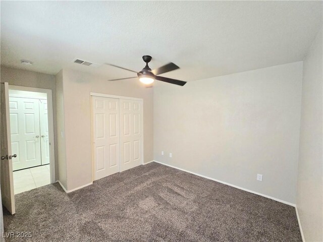 2035 E Warm Springs Rd Unit 1017, Las Vegas, NV 89119 - unfurnished bedroom with carpet flooring, a closet, baseboards, and a ceiling fan