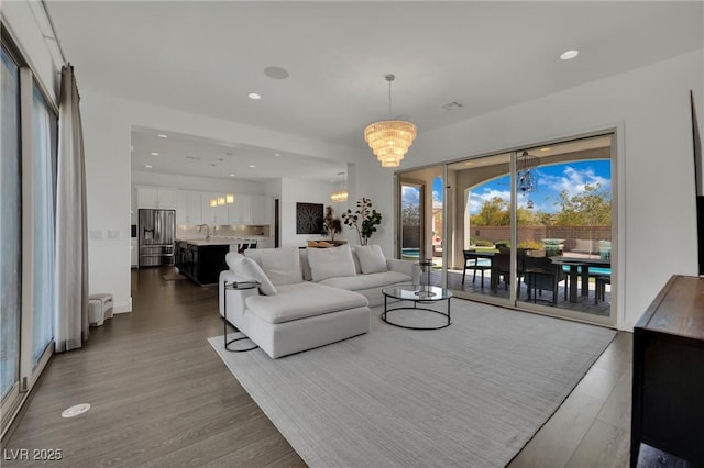 362 Port Reggio St, Las Vegas, NV 89138 - living room with a chandelier, dark wood-style flooring, and recessed lighting