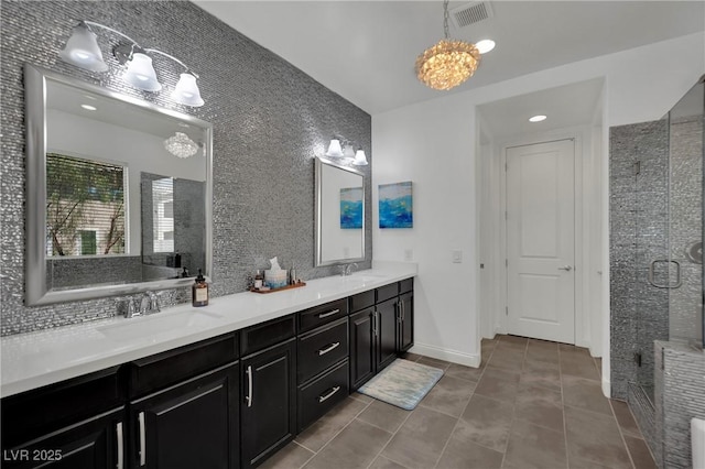 362 Port Reggio St, Las Vegas, NV 89138 - bathroom featuring a shower stall, double vanity, a chandelier, and tile patterned floors