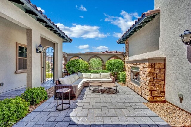 362 Port Reggio St, Las Vegas, NV 89138 - view of patio featuring an outdoor living space with a fireplace