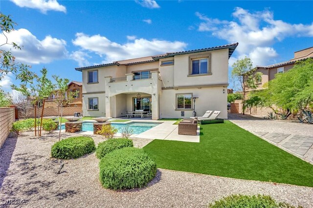 362 Port Reggio St, Las Vegas, NV 89138 - rear view of property featuring a patio, stucco siding, a balcony, and outdoor lounge area
