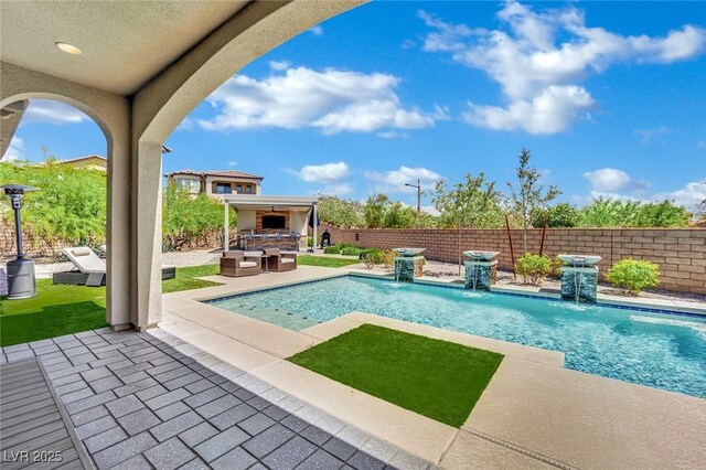 362 Port Reggio St, Las Vegas, NV 89138 - view of swimming pool with an outdoor kitchen, a patio area, and a fenced backyard