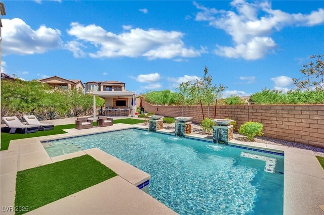 362 Port Reggio St, Las Vegas, NV 89138 - view of swimming pool featuring a fenced backyard, a patio area, and an outdoor living space