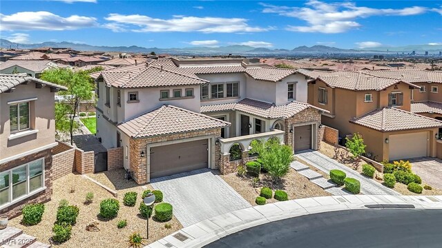 362 Port Reggio St, Las Vegas, NV 89138 - view of front facade featuring stucco siding, a residential view, a tile roof, and decorative driveway