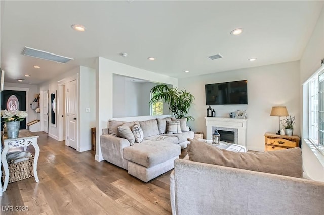 615 D Ave, Boulder City, NV 89005 - living room with wood finished floors, recessed lighting, a brick fireplace, and baseboards