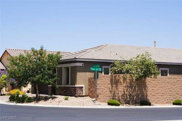 10262 Havasu Falls St, Las Vegas, NV 89141 - view of front facade featuring stucco siding and a tiled roof