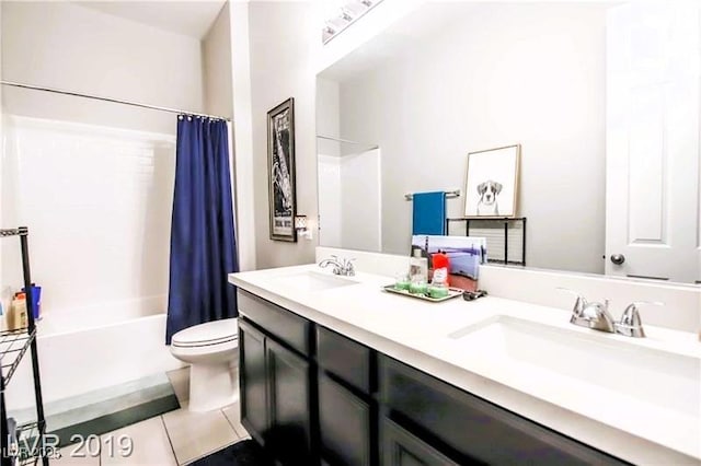 10262 Havasu Falls St, Las Vegas, NV 89141 - bathroom featuring toilet, double vanity, shower / bath combo with shower curtain, and tile patterned floors
