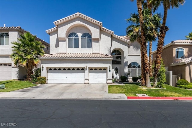 2090 Eaglepath Cir, Henderson, NV 89074 - mediterranean / spanish-style house with a garage, driveway, stucco siding, a front lawn, and a tile roof