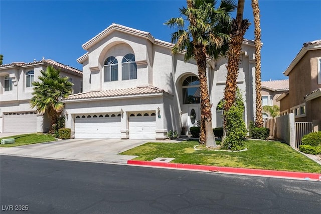 2090 Eaglepath Cir, Henderson, NV 89074 - mediterranean / spanish-style house with an attached garage, driveway, stucco siding, and a tile roof