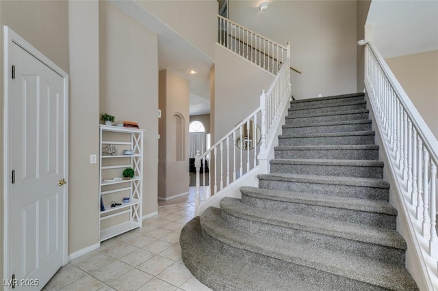 2090 Eaglepath Cir, Henderson, NV 89074 - stairway featuring tile patterned flooring, a high ceiling, and baseboards