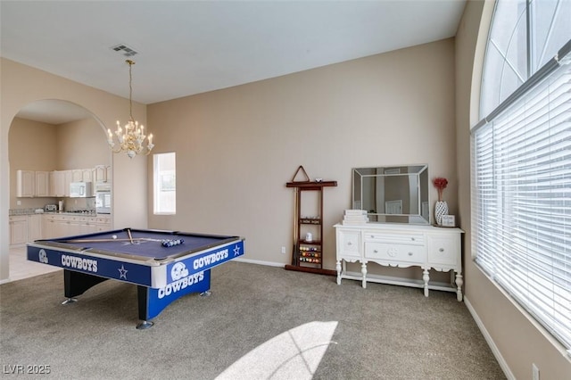 2090 Eaglepath Cir, Henderson, NV 89074 - playroom with arched walkways, plenty of natural light, a chandelier, and light carpet