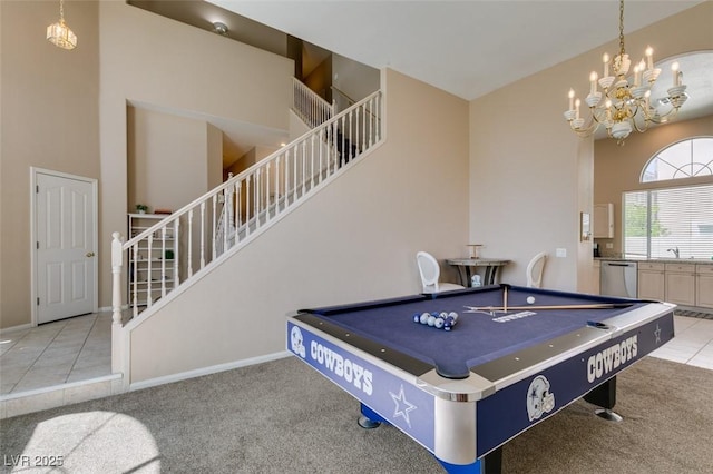 2090 Eaglepath Cir, Henderson, NV 89074 - playroom featuring light carpet, a chandelier, billiards table, light tile patterned floors, and baseboards