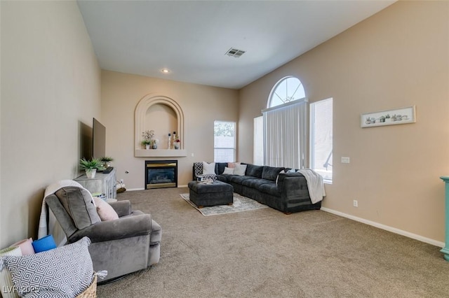 2090 Eaglepath Cir, Henderson, NV 89074 - carpeted living area featuring baseboards, a glass covered fireplace, and recessed lighting