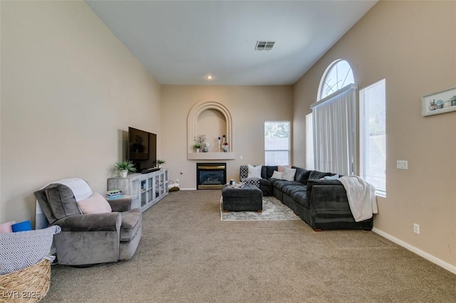 2090 Eaglepath Cir, Henderson, NV 89074 - carpeted living room featuring baseboards and a glass covered fireplace