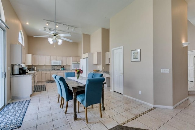 2090 Eaglepath Cir, Henderson, NV 89074 - dining space featuring high vaulted ceiling, a ceiling fan, baseboards, and light tile patterned floors