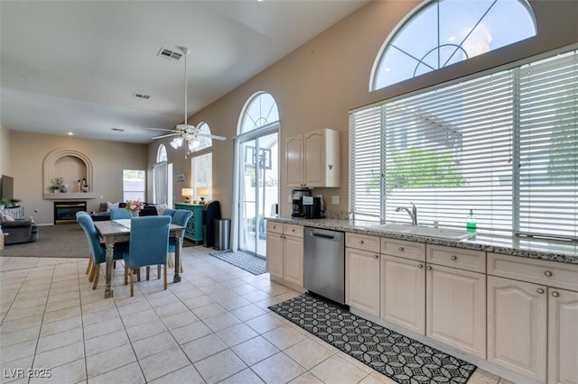 2090 Eaglepath Cir, Henderson, NV 89074 - kitchen with dishwasher, a sink, light tile patterned floors, open floor plan, and ceiling fan