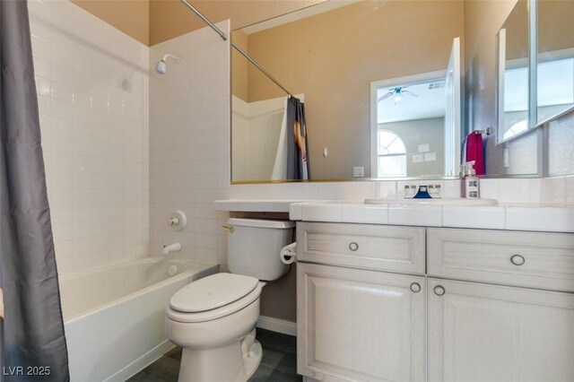2090 Eaglepath Cir, Henderson, NV 89074 - bathroom with shower / bathtub combination with curtain, toilet, vanity, and a ceiling fan