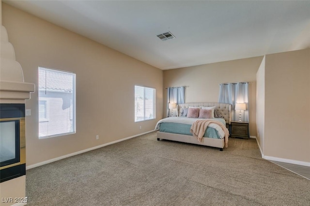 2090 Eaglepath Cir, Henderson, NV 89074 - bedroom with carpet flooring, a multi sided fireplace, and baseboards