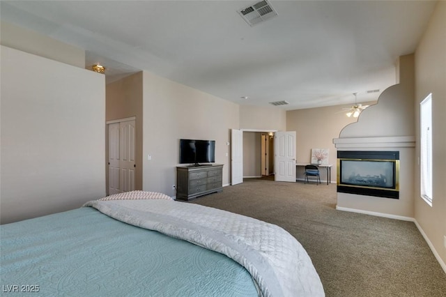 2090 Eaglepath Cir, Henderson, NV 89074 - bedroom featuring a multi sided fireplace, carpet flooring, and baseboards