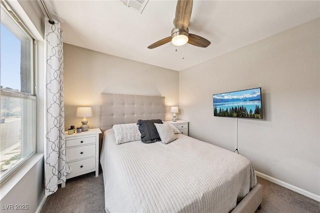 8042 Misty Canyon Ave, Las Vegas, NV 89113 - bedroom with dark carpet, multiple windows, and ceiling fan