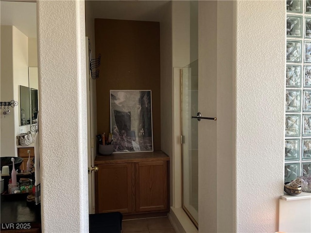 5043 Gable Crest Ct, Las Vegas, NV 89141 - corridor with a textured wall and tile patterned flooring