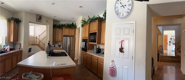 5043 Gable Crest Ct, Las Vegas, NV 89141 - kitchen with black appliances, a kitchen island, light countertops, brown cabinets, and recessed lighting