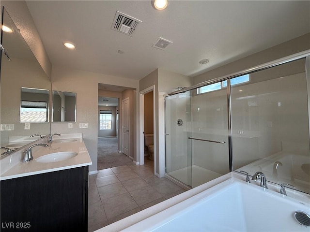 2620 Tolmezzo St, Henderson, NV 89044 - bathroom with a bath, double vanity, tile patterned flooring, toilet, and a shower stall