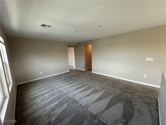 2620 Tolmezzo St, Henderson, NV 89044 - spare room with dark carpet and baseboards