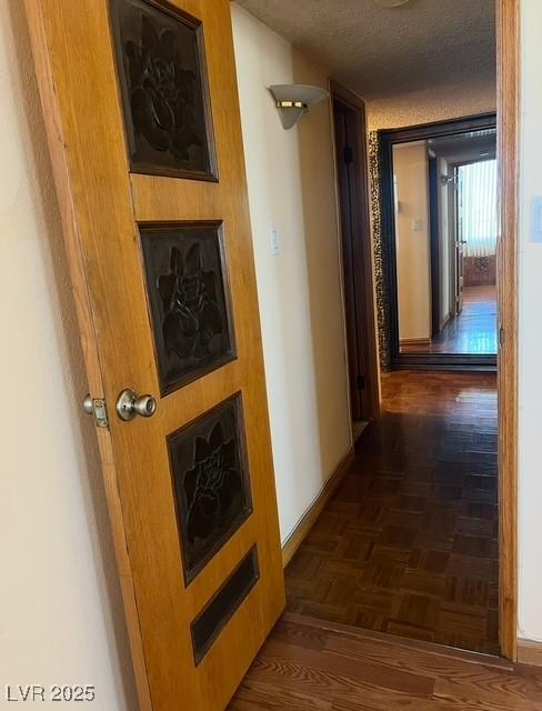 3930 University Center Dr Unit 612, Las Vegas, NV 89119 - hallway with baseboards and a textured ceiling