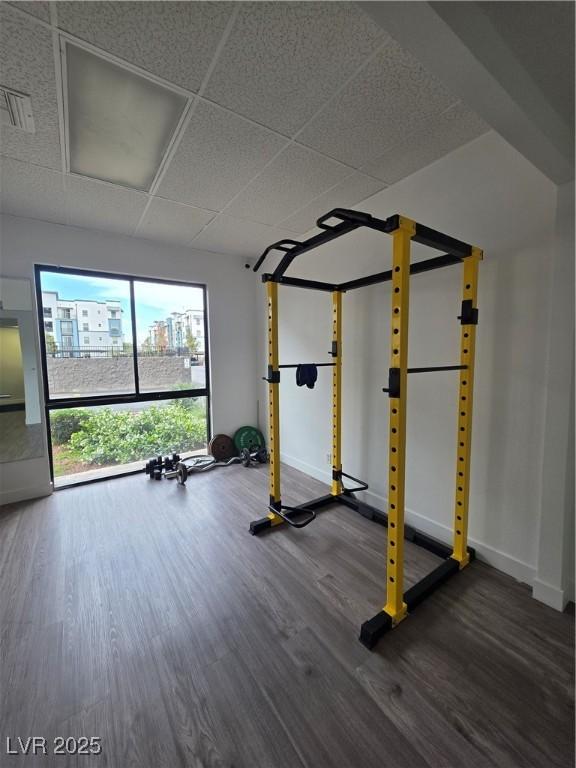 3930 University Center Dr Unit 612, Las Vegas, NV 89119 - workout room with wood finished floors, baseboards, and a drop ceiling