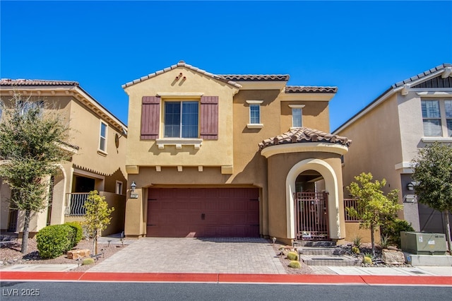 1794 Morro Vista Dr, Las Vegas, NV 89135 - mediterranean / spanish-style house featuring an attached garage, a tile roof, stucco siding, and driveway