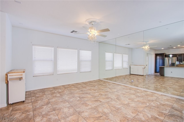 1794 Morro Vista Dr, Las Vegas, NV 89135 - unfurnished living room with ceiling fan and baseboards