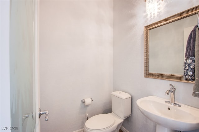 1794 Morro Vista Dr, Las Vegas, NV 89135 - bathroom with toilet, baseboards, and a sink