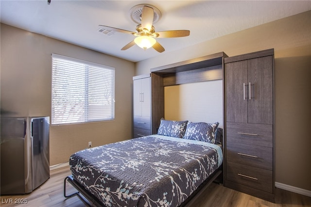 1794 Morro Vista Dr, Las Vegas, NV 89135 - bedroom featuring wood finished floors, baseboards, and a ceiling fan