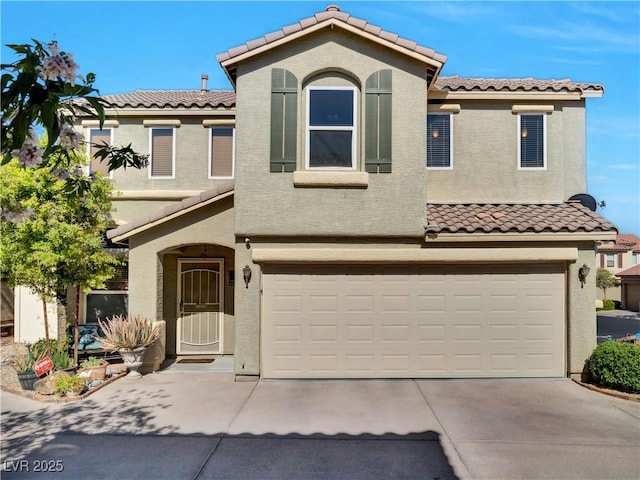 8754 Brindisi Park Ave, Las Vegas, NV 89148 - mediterranean / spanish house featuring a tiled roof, an attached garage, stucco siding, and concrete driveway